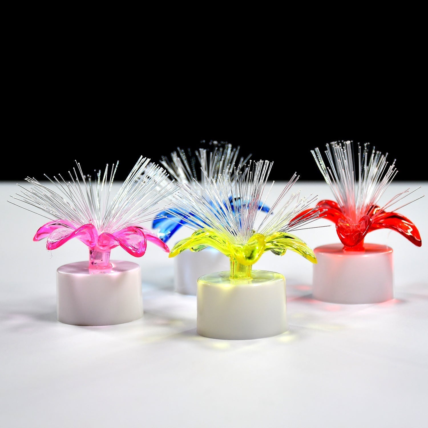 LED table centerpiece with fiber optic light, color-changing. LED table centerpiece with fiber optic light, color-changing.
